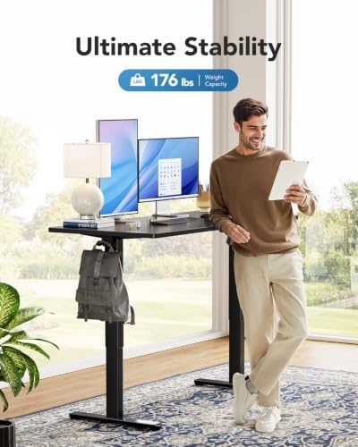 HUANUO Electric Standing Desk, Whole Piece Desktop, Adjustable Height Computer Desk, 4 Height Memory Settings, Sit Stand Up Desk for Home Office, 55" x 27", Black