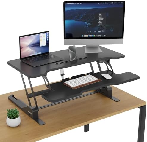 Mount-It! Electric Standing Desk Converter with 38" Tabletop, Height Adjustable Sit Stand Desk Riser, Motorized Desk Riser with Keyboard Tray and Device Slot, Fits Monitor & Laptop, Black