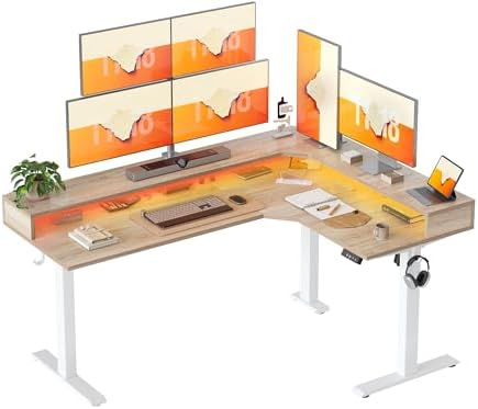 TIQLAB 63'' L-Shaped Standing Desk with LED Light Strip and Power Outlet, Height Adjustable Corner Table with Ergonomic Monitor Stand, Maple