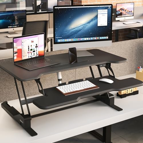 Mount-It! Electric Standing Desk Converter with 38" Tabletop, Height Adjustable Sit Stand Desk Riser, Motorized Desk Riser with Keyboard Tray and Device Slot, Fits Monitor & Laptop, Black