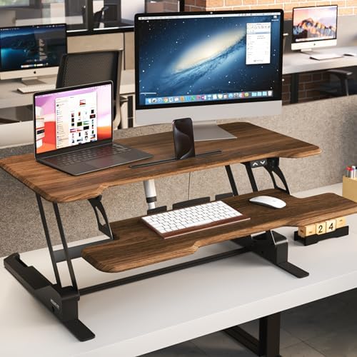 Mount-It! Electric Standing Desk Converter with 38" Tabletop, Height Adjustable Desk Riser, Motorized Desk Riser with Keyboard Tray and Device Slot, Fits Monitor & Laptop, Dark Walnut