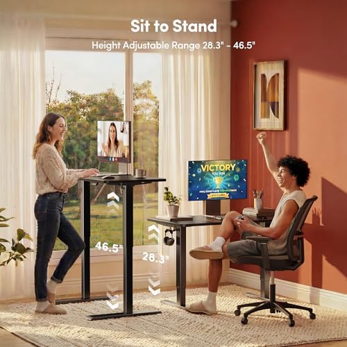 FEZIBO 55 x 24 Inchs Electric Standing Desk, Height Adjustable, Sit Stand Up, Computer Office Desk with Splice Board, Black Frame/Black Top