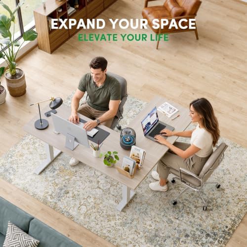 FEZIBO 63" x 55"L Shaped Standing Desk Adjustable Height, Electric Stand up Corner Computer Desk, Sit Stand Home Office Desk with Splice Board, Light Walnut Top/White Frame